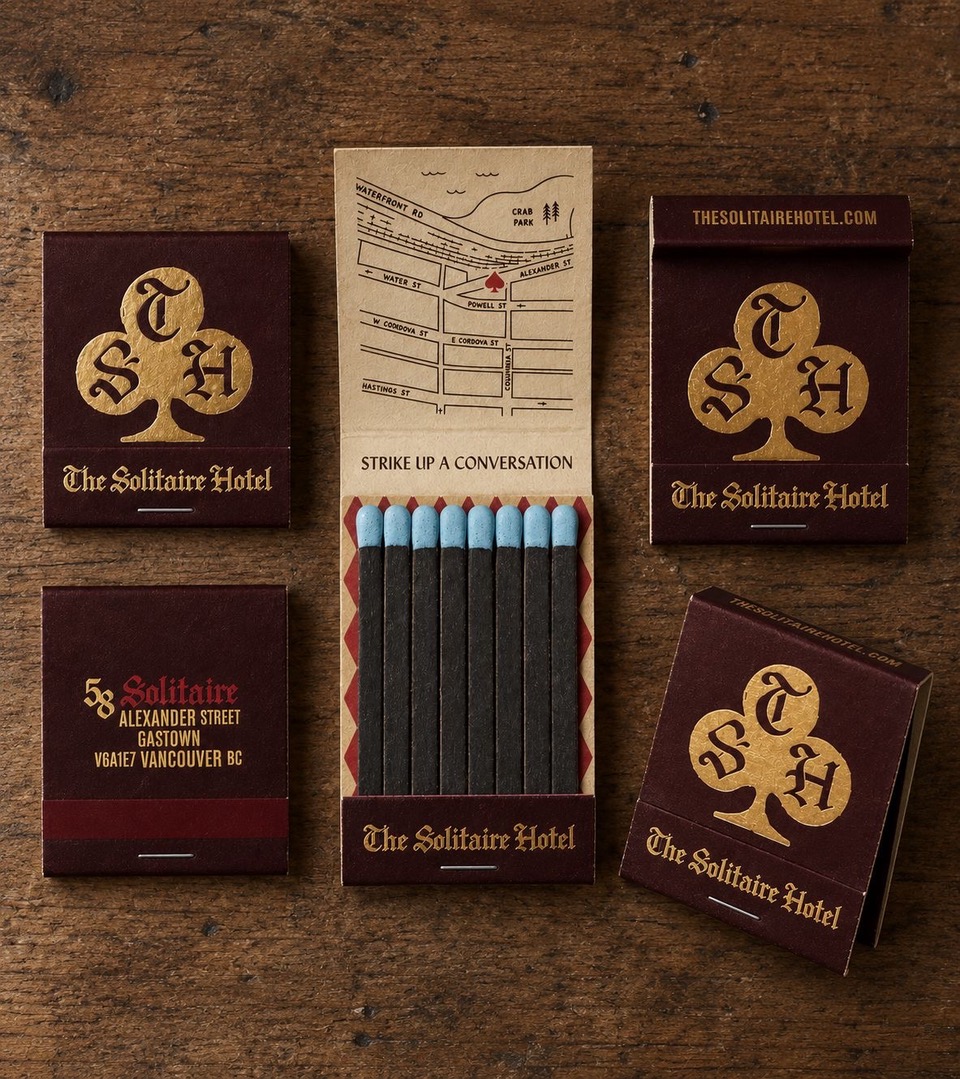 Solitaire Hotel matchbooks, one open to a map of Gastown